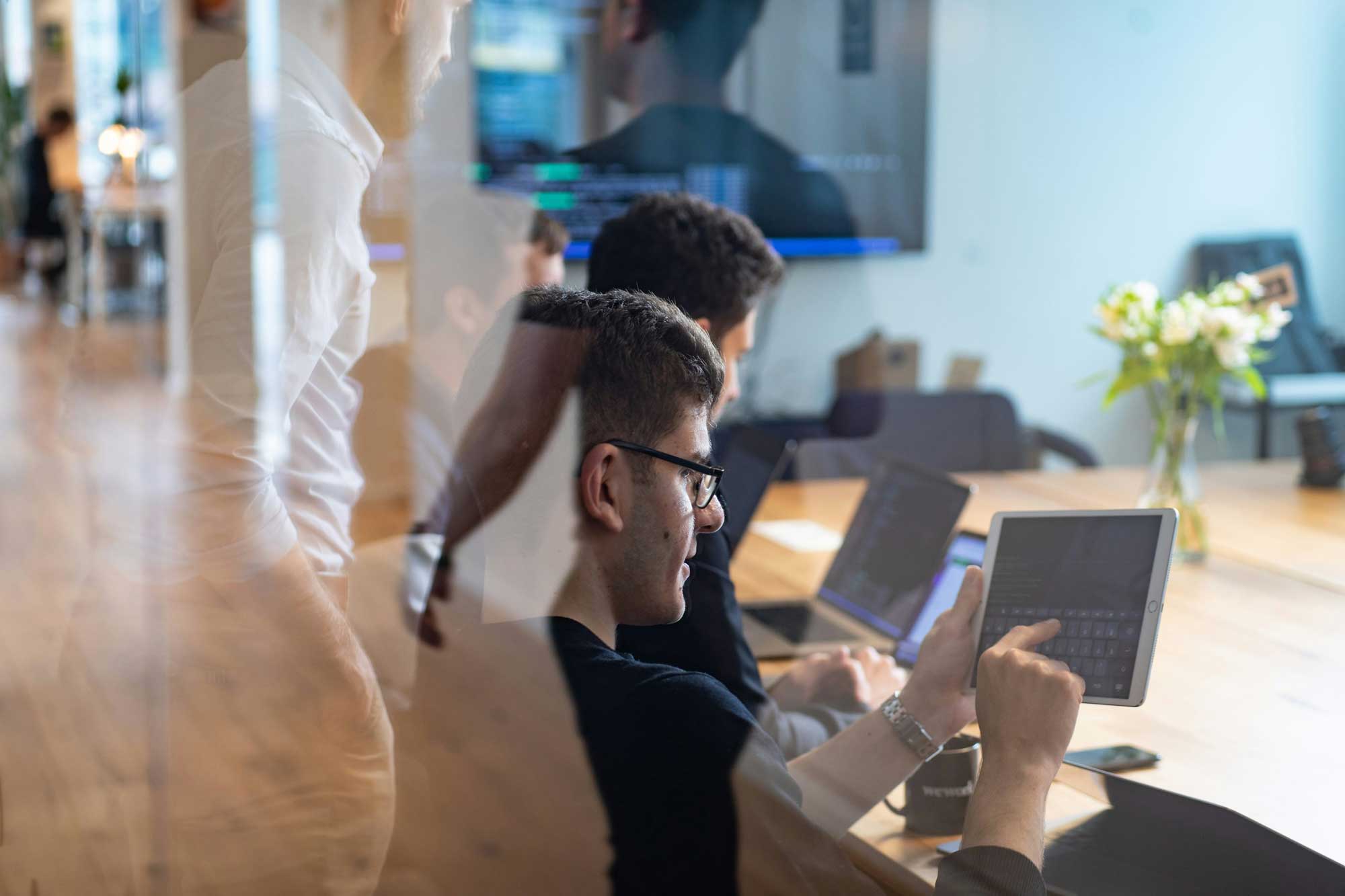 Avensus team working together on a cryptographic challenge